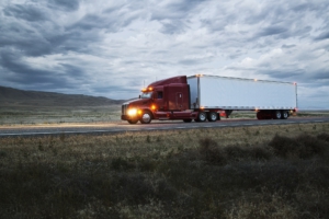 truck on a highway through the grasslands area of eastern Washington, USA.