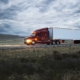 truck on a highway through the grasslands area of eastern Washington, USA.