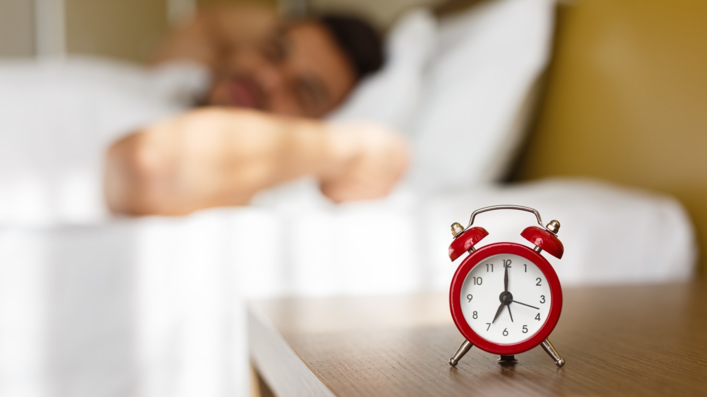 Arab man waking up in bed fully rested