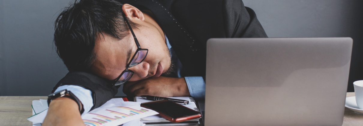 Businessman sleeping at office