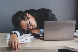 Businessman sleeping at office