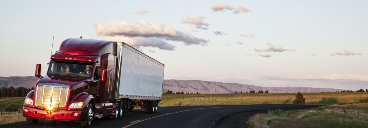 truck on a highway through the grasslands area of eastern Washington, USA.