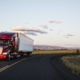 truck on a highway through the grasslands area of eastern Washington, USA.