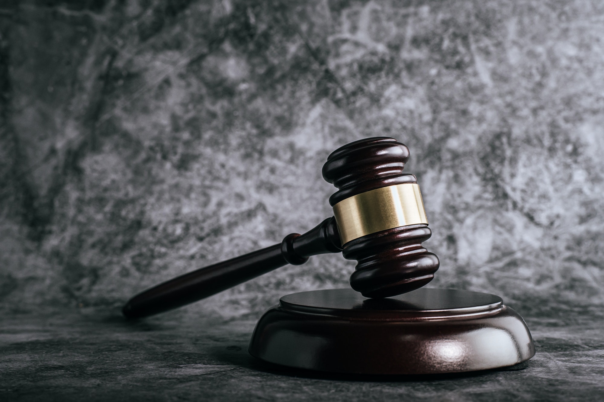 wooden-judges-gavel-on-table-in-a-courtroom-or-enforcement-office-.jpg