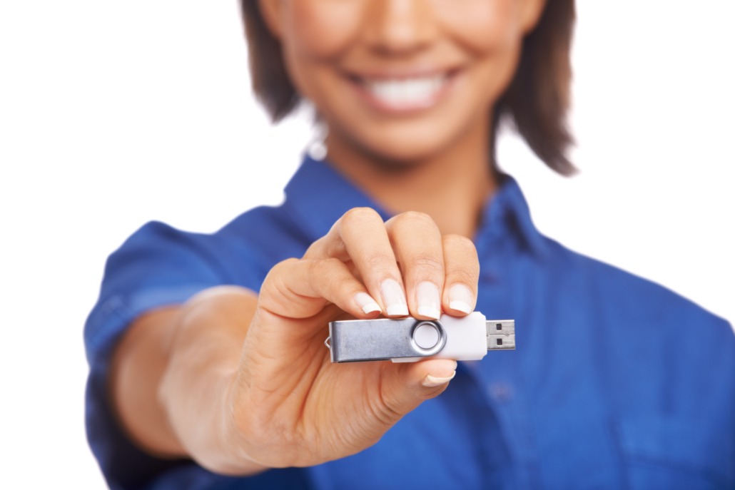 Plenty of space on this one. An african-american woman showing you a USB stick.