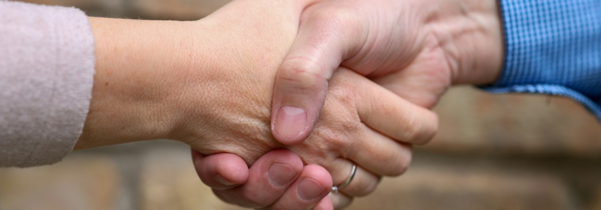 Two people are shaking hands.