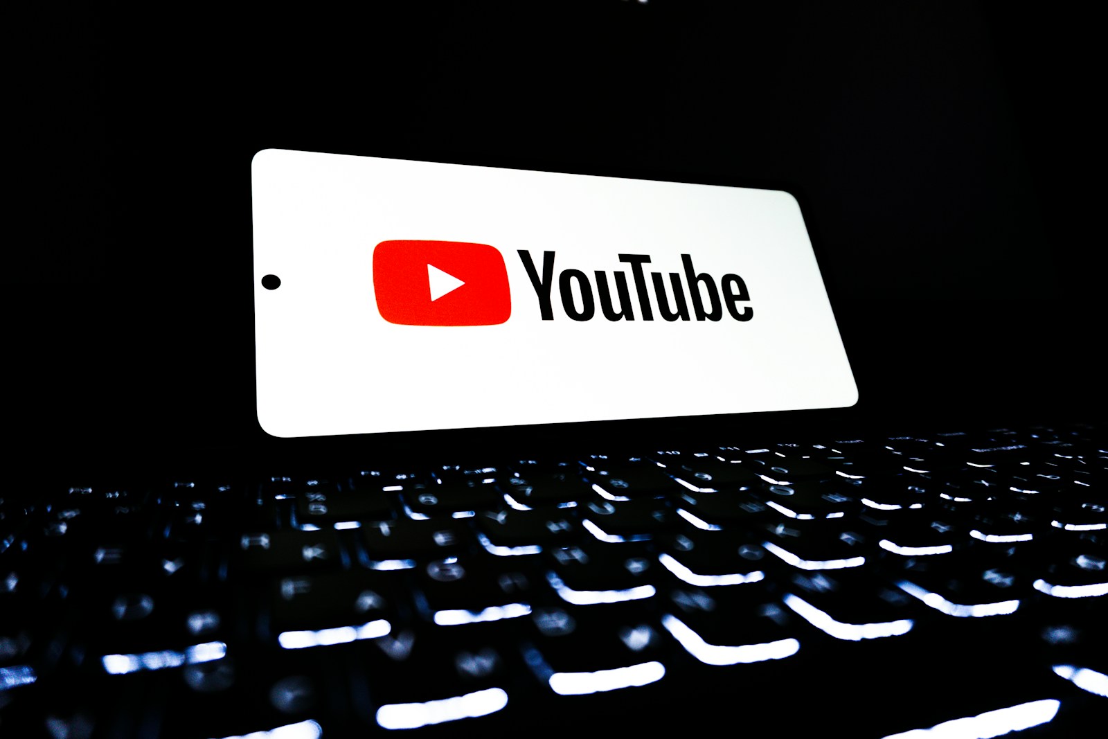 Youtube logo displayed on a keyboard.